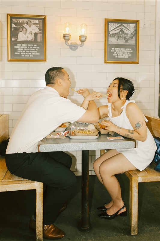 Bride and groom celebrating elopement at Blue Ribbon Fried Chicken in NYC