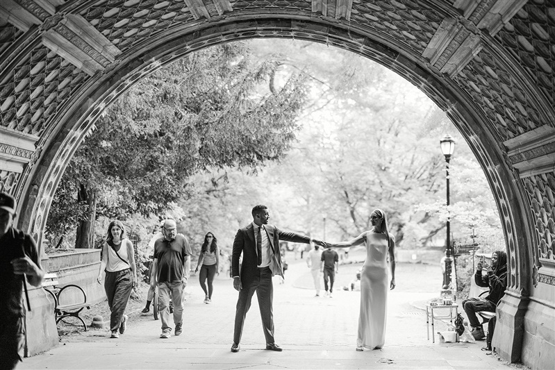 Bride and groom photo underneath bridge in Prospect Park