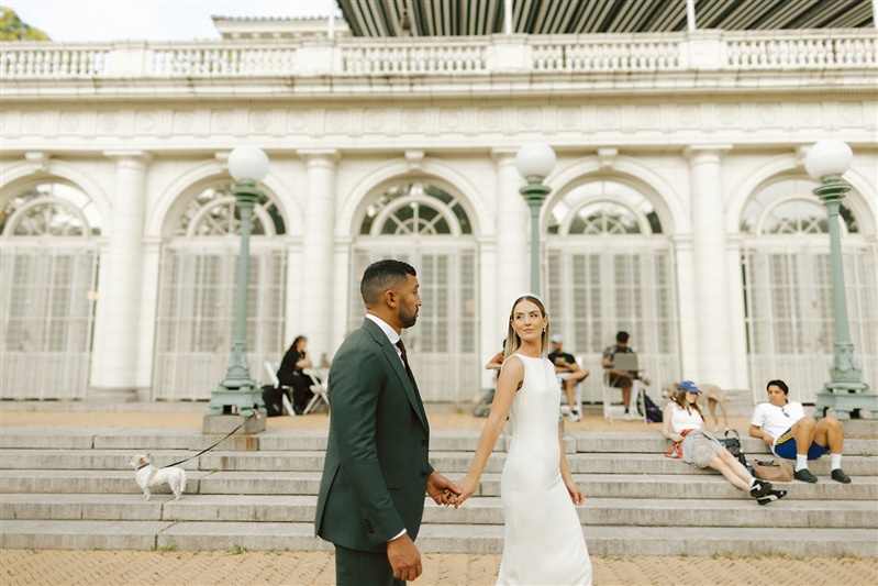 Bride and groom photo holding hands and walking at Boathouse from Prospect Park wedding