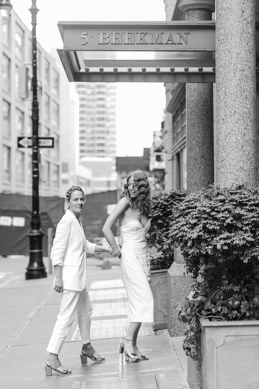 Wedding photography of couple walking into hotel as a part of documentary wedding photos.