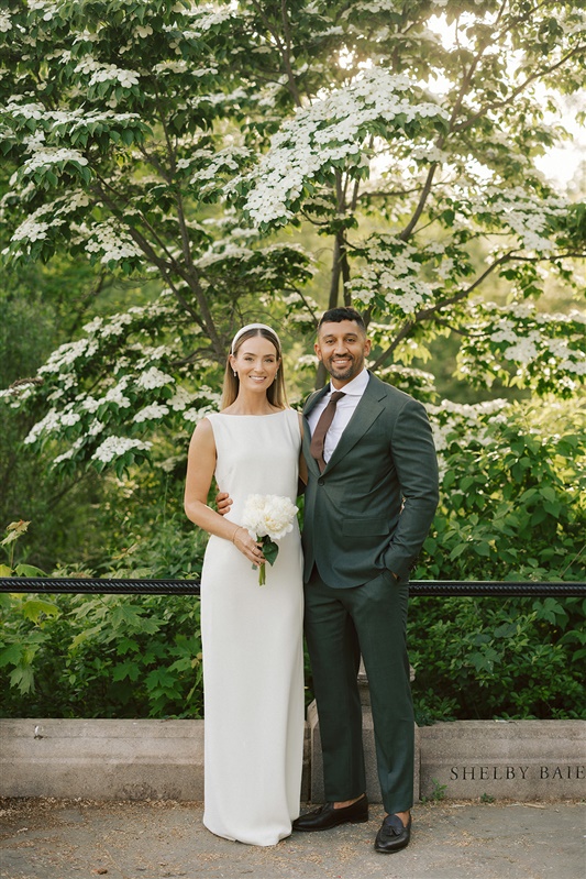 Bride and groom photo from Prospect Park wedding with green and white trees behind them